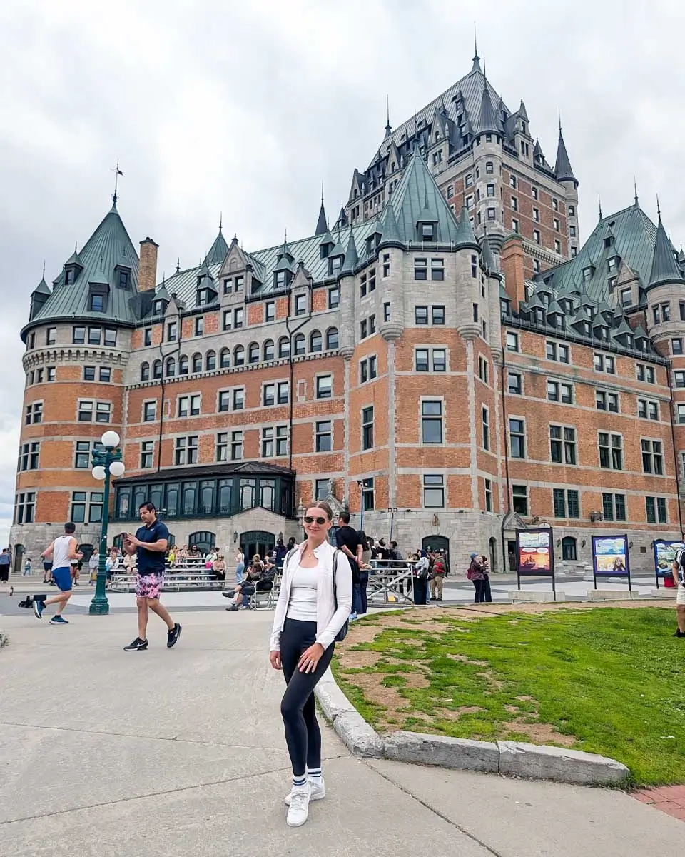 Bailey posing in front of Fairmont Le Château Frontenac in Quebec City