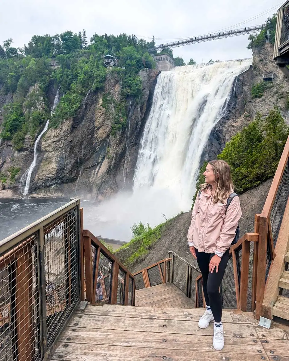 Bailey posing in front of Montmorency Falls in Quebec