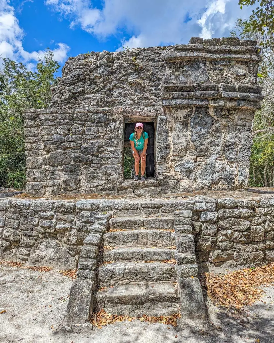 Bailey standing at one of the temples at Zona Arqueológica San Gervasio in Cozumel, Mexico