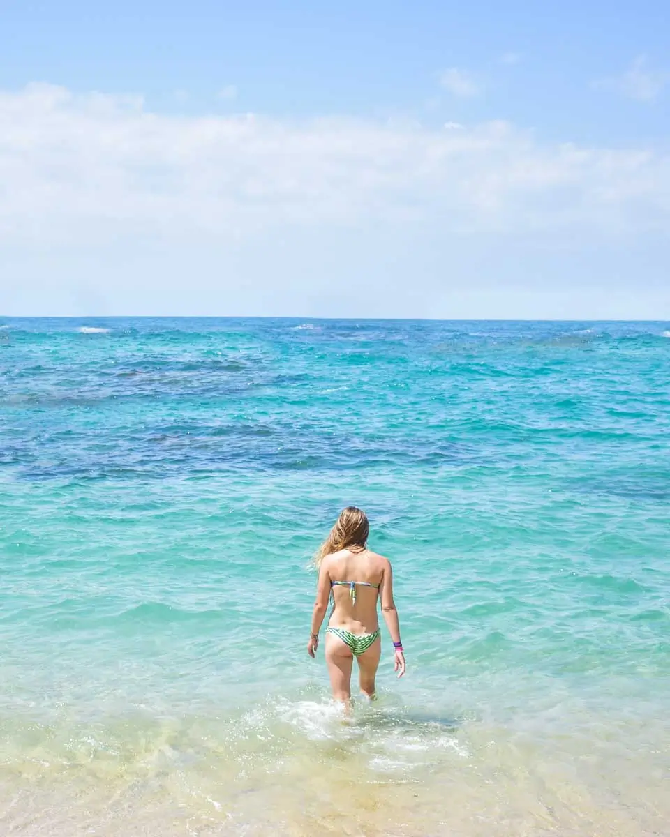 Bailey standing at the beach at Mr. Sanchos Beach Club in Cozumel, Mexico