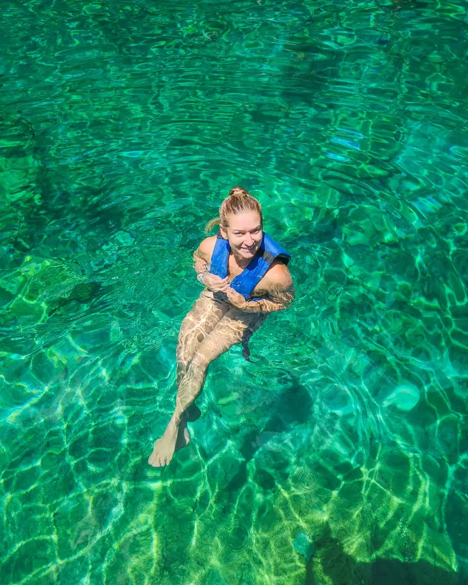 Bailey swims in Jade Caverns cenote in Cozumel, Mexico