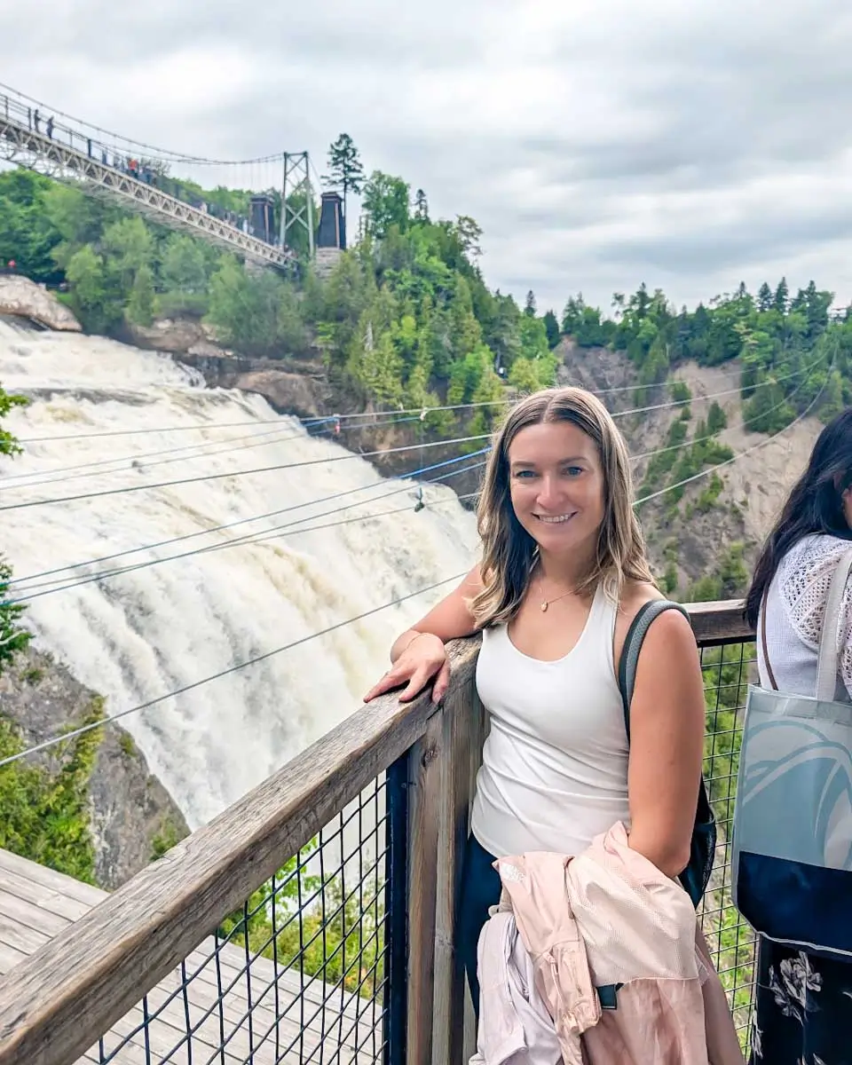 Bailey takes photo at a viewpoint of Montmorency Falls in Quebec