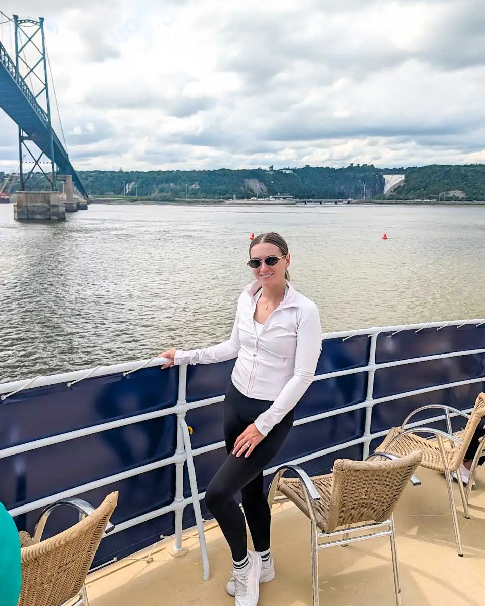 Bailey taking a photo on a cruise along the St. Lawrence River in Quebec