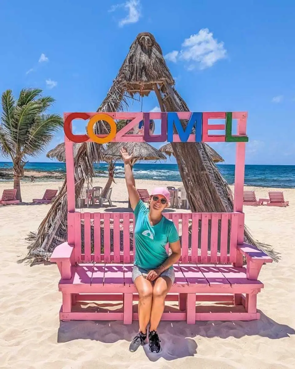 Bailey taking a photo with the Cozumel sign in Cozumel, mexico-2
