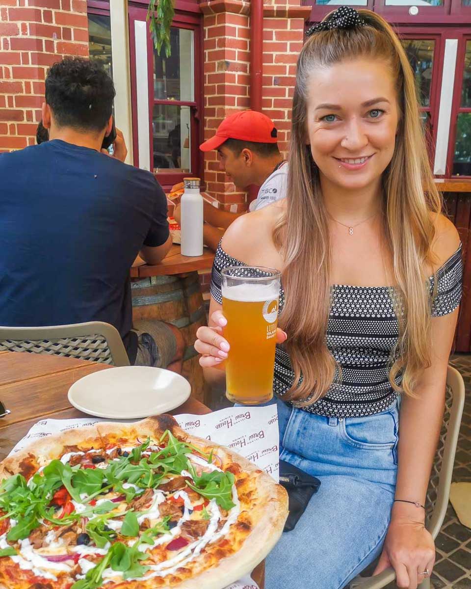 Bailey-with-a-beer-and-pizza-in-Boulder-Colorado