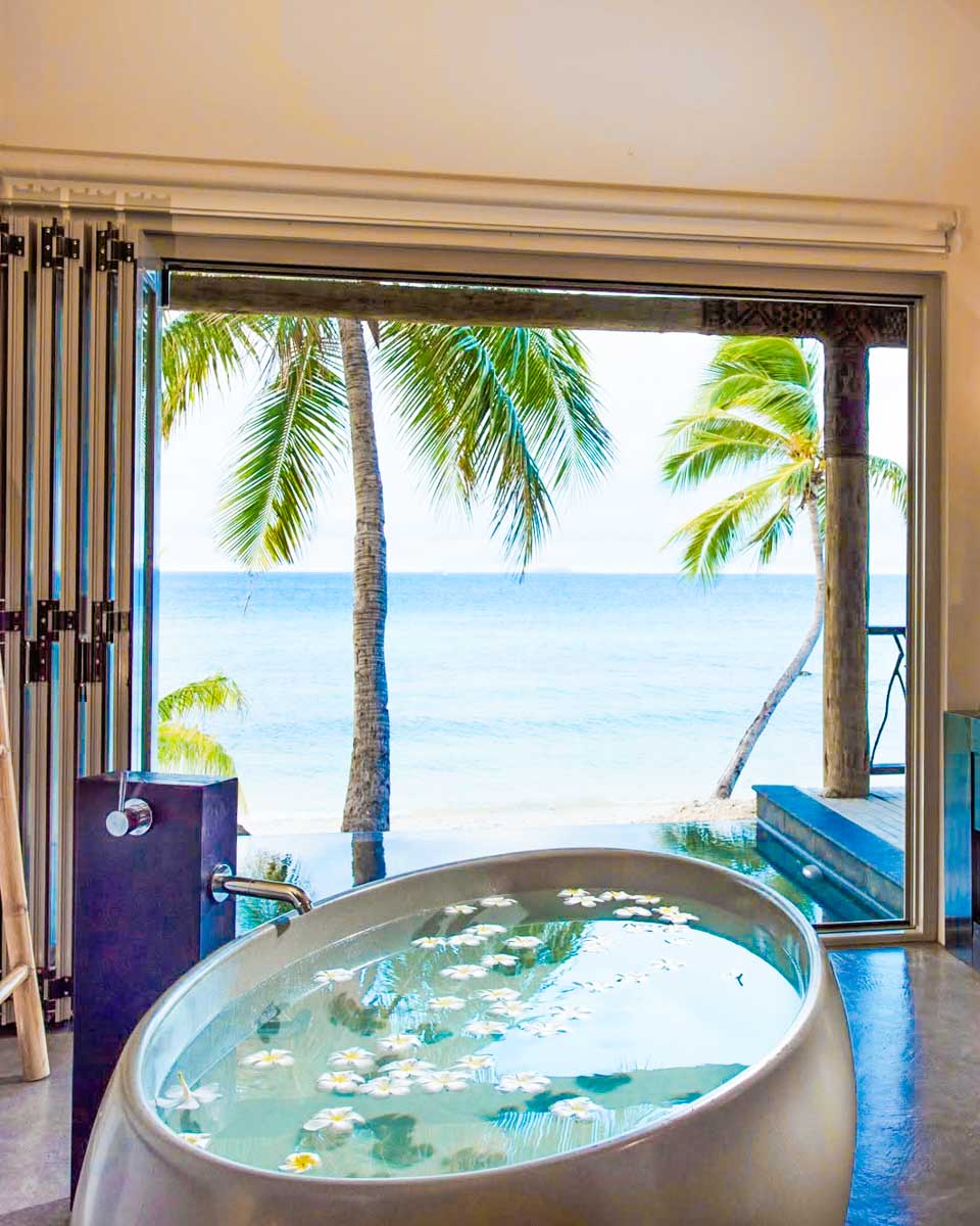 Bathroom with bathtub overlooking the ocean at Tadrai Island Resort in Fiji
