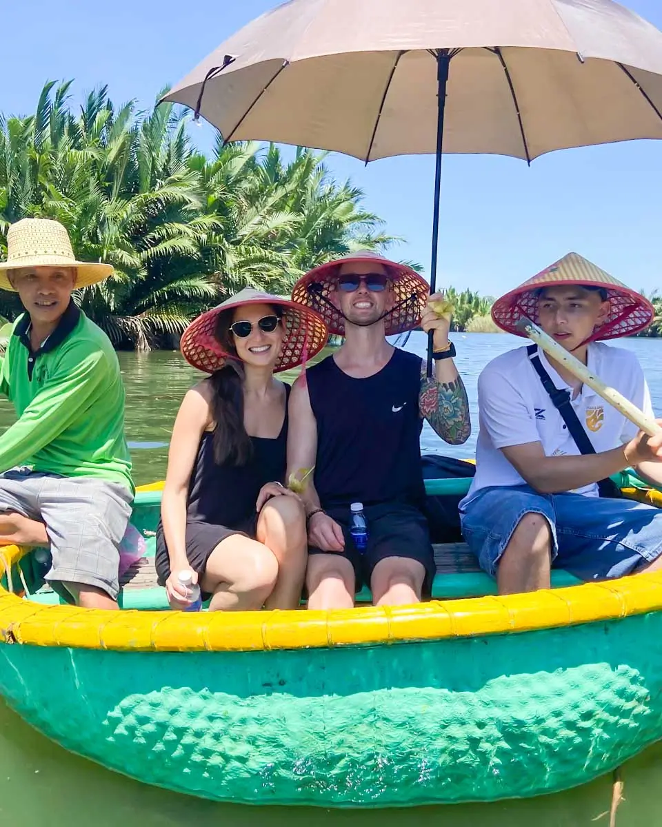 Brittni and Jesse taking photo on the coconut basket boat in Hoi An, Vietnam