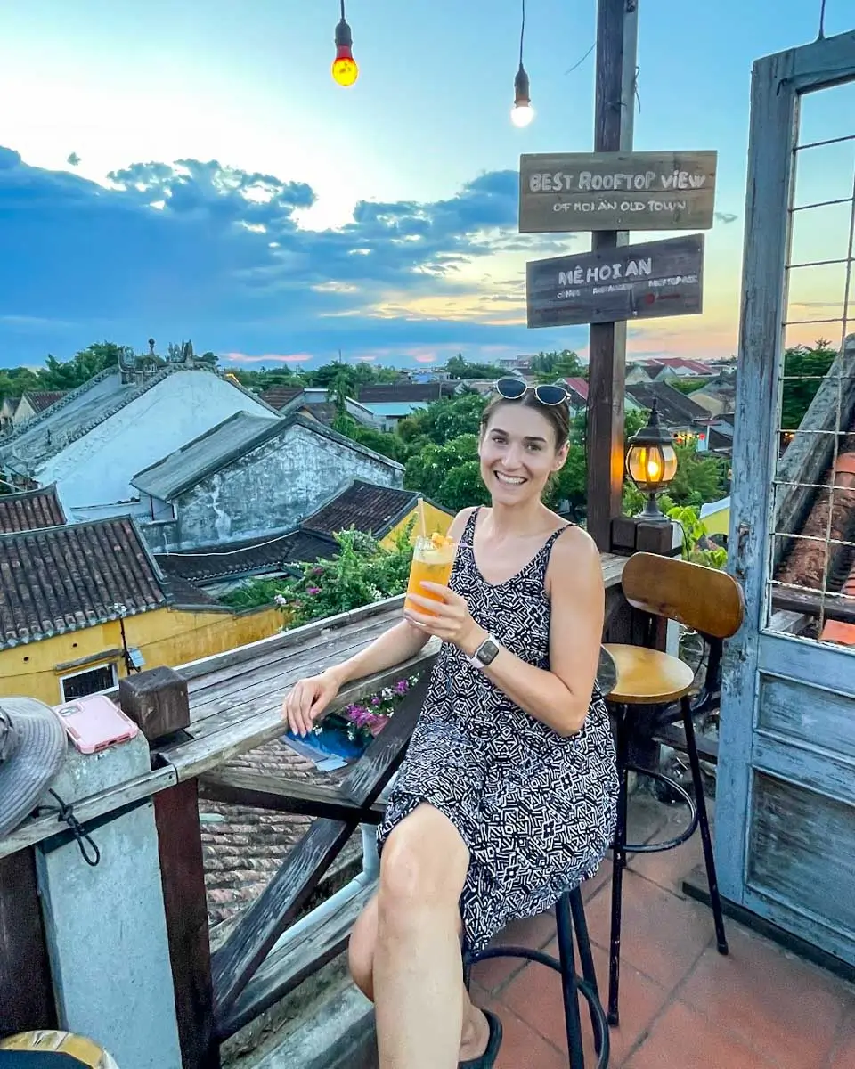 Brittni enjoying drink at the rooftop in Hoi An, Vietnam