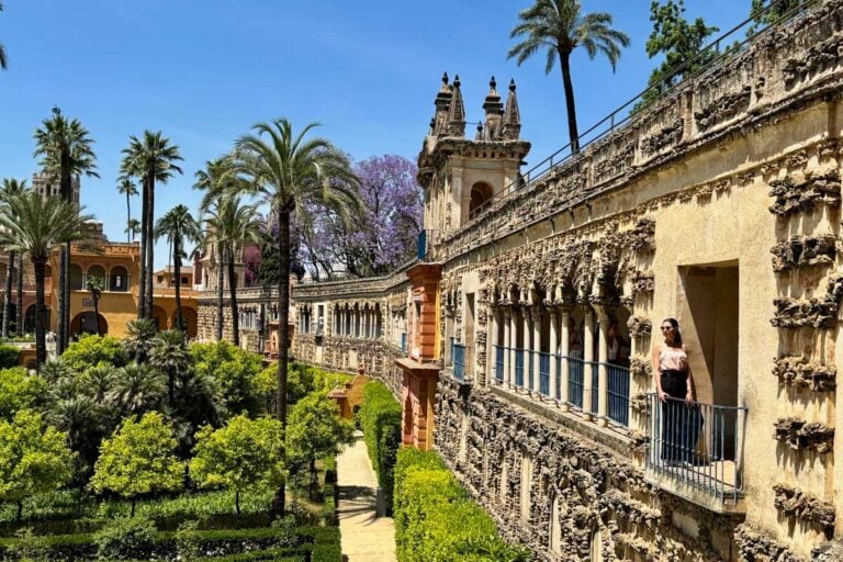 Brittni poses for a photo looking over the gardens at the Royal Alcazar of Seville