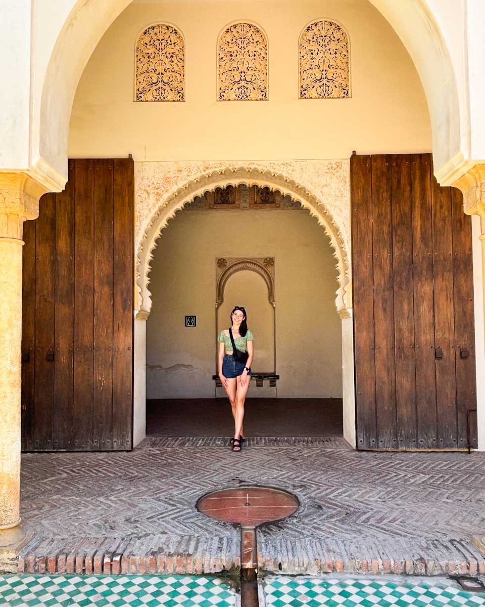 Brittni poses under one of the arches in the Alcazaba in Malaga
