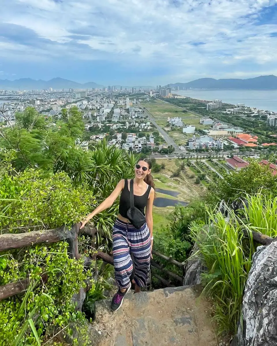 Brittni taking a photo at the Marble Mountains, Vietnam