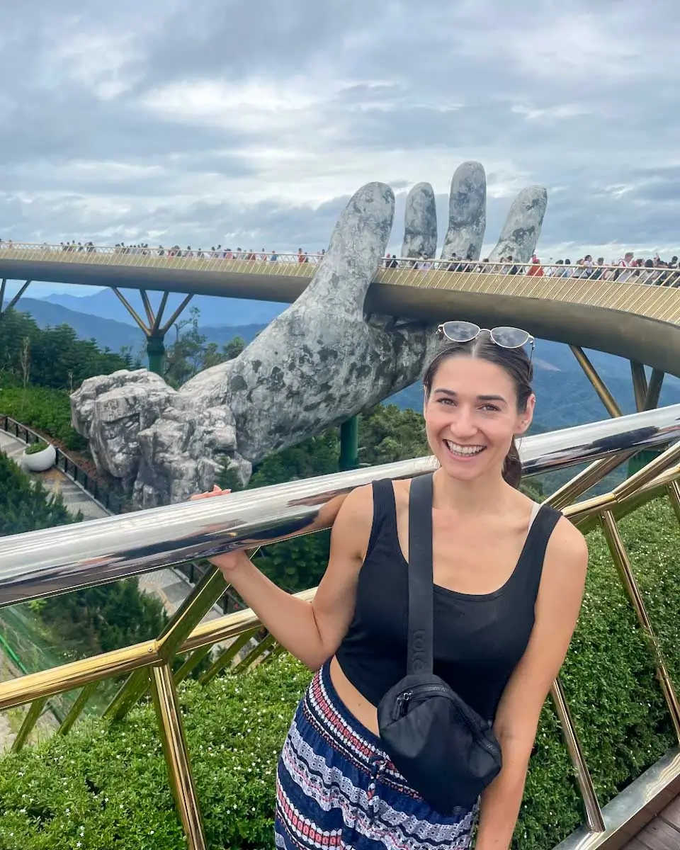 Brittni taking photo at the Golden Hands Bridge in Ba Na Hills, Vietnam