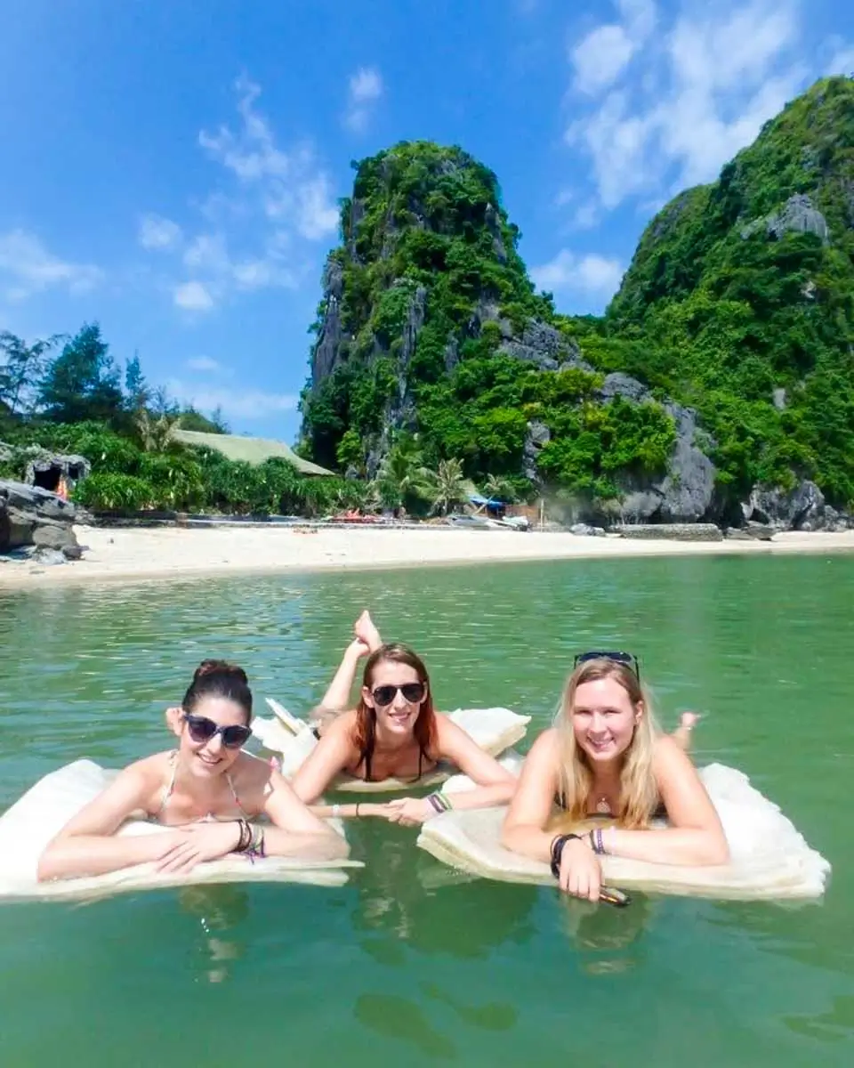 Brittni with friends swimming in Ha Long Bay, Vietnam