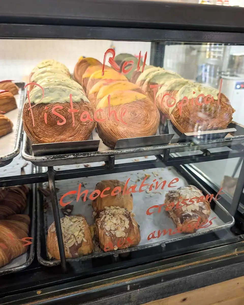Croissants and sweet rolls displayed at Boulangerie caviste bakery in Montreal, Quebec