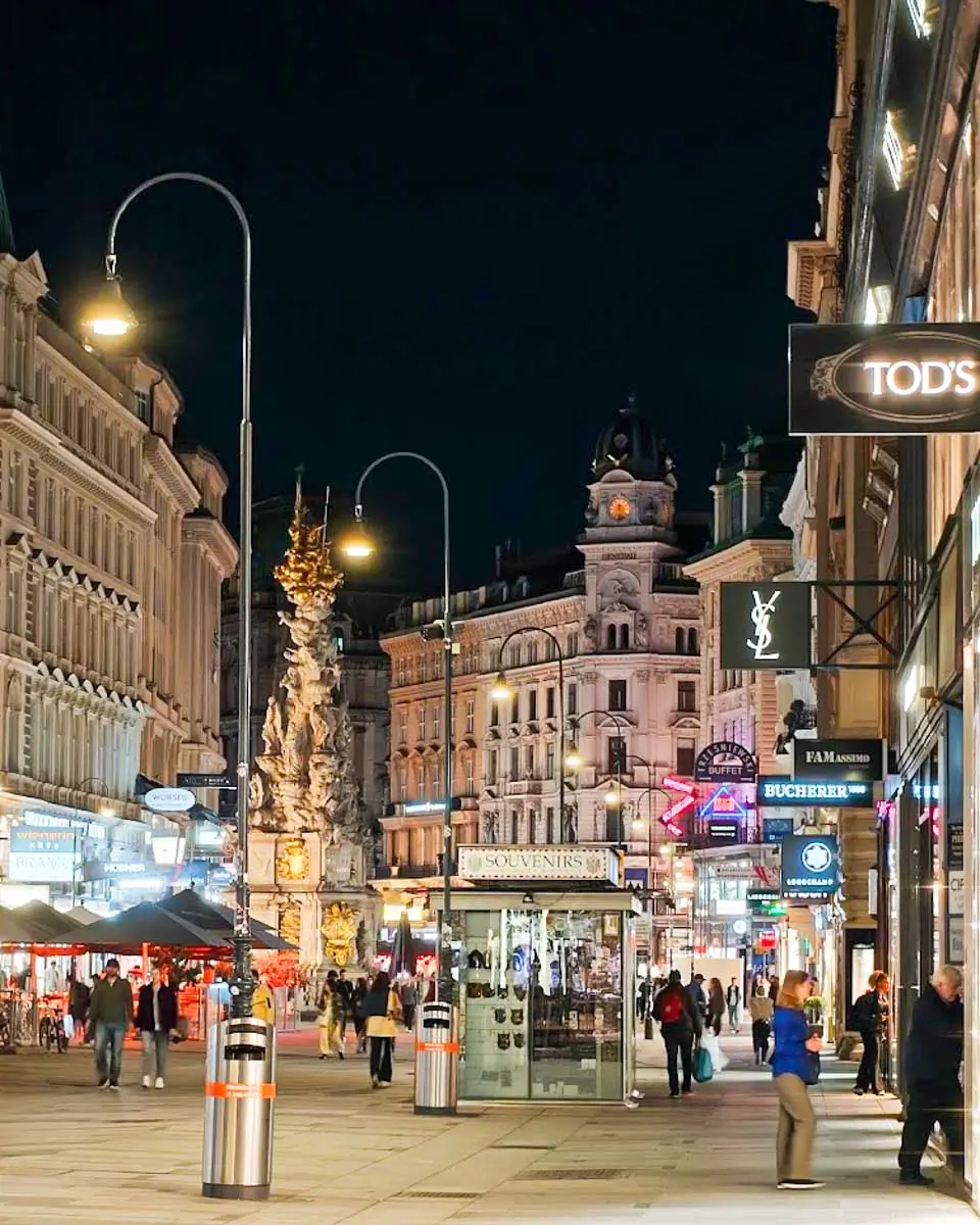Busy street in downtown Vienna at night