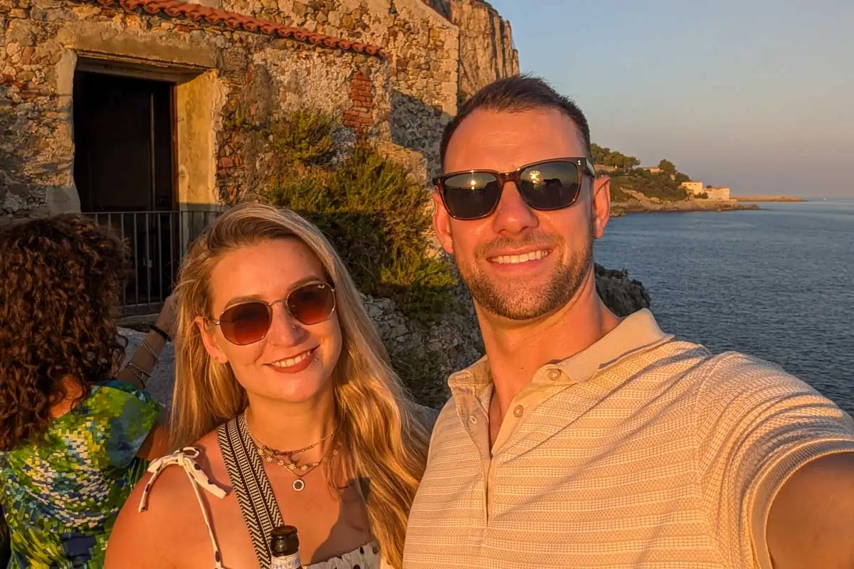 Daniel and Bailey smile at sunset in Portugal