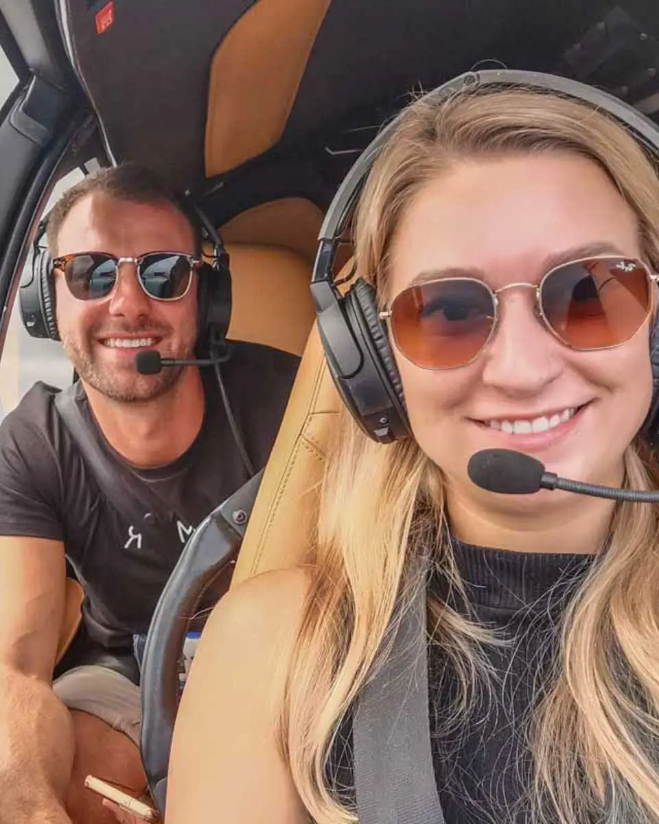 Daniel and Bailey taking a selfie on a flight over Newport Beach
