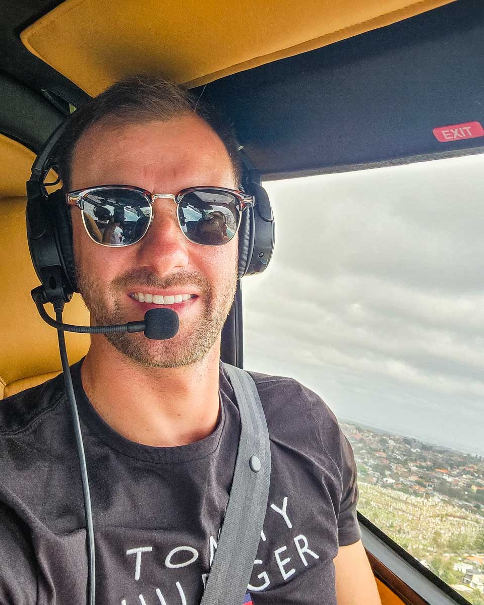 Daniel taking selfie while flying above Orange County