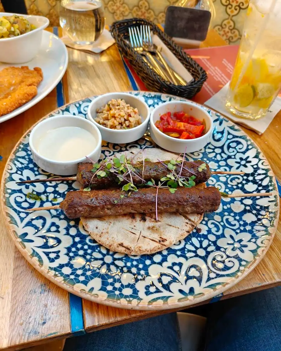 Delicious kebab skewers at Mazel Tov restaurant in Budapest