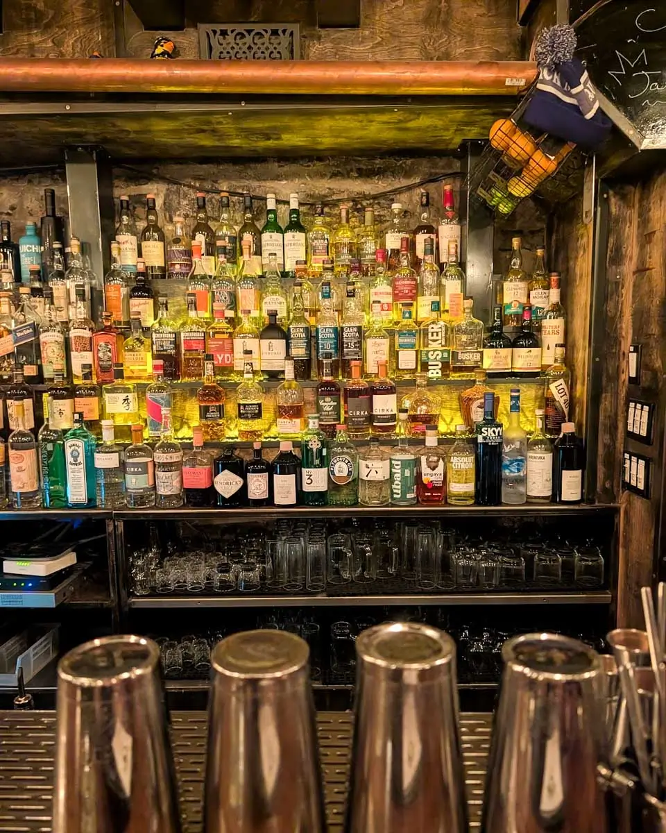 Drinks lined on the shelf at the Coldroom speakeasy in Montreal, Quebec