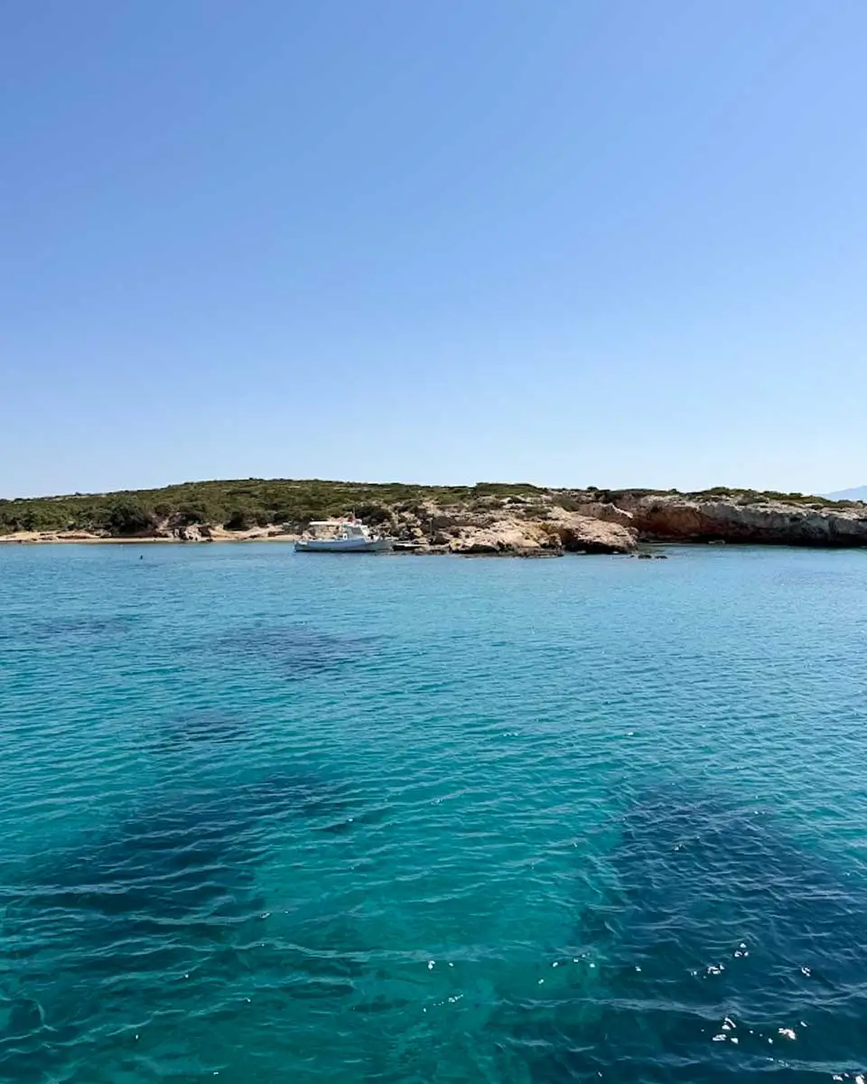 Turquoise waters seen from a ferry leaving Santorini.