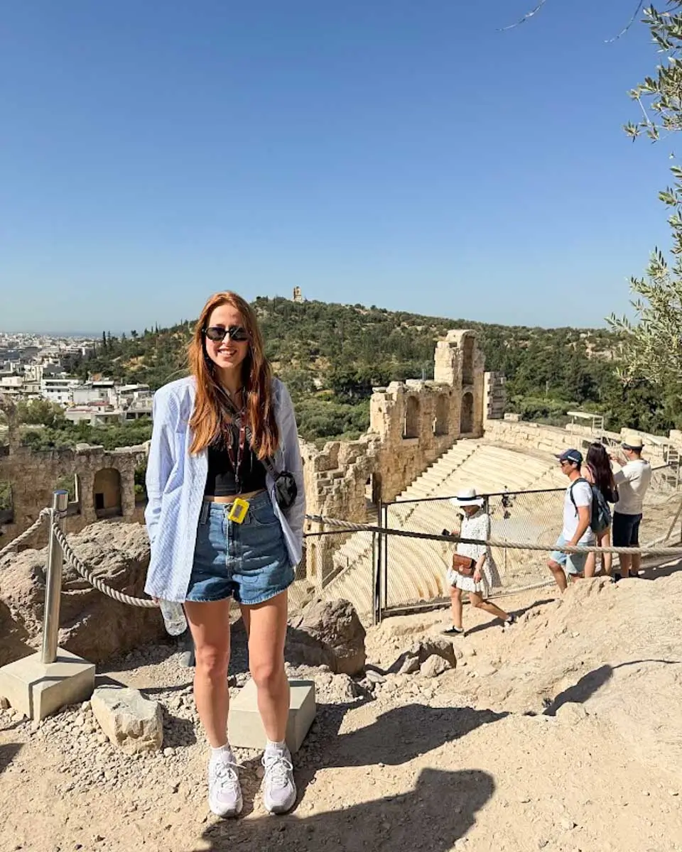 Hannah standing near the Odeon of Herodes Atticus at the Acropolis in Athens, Greece