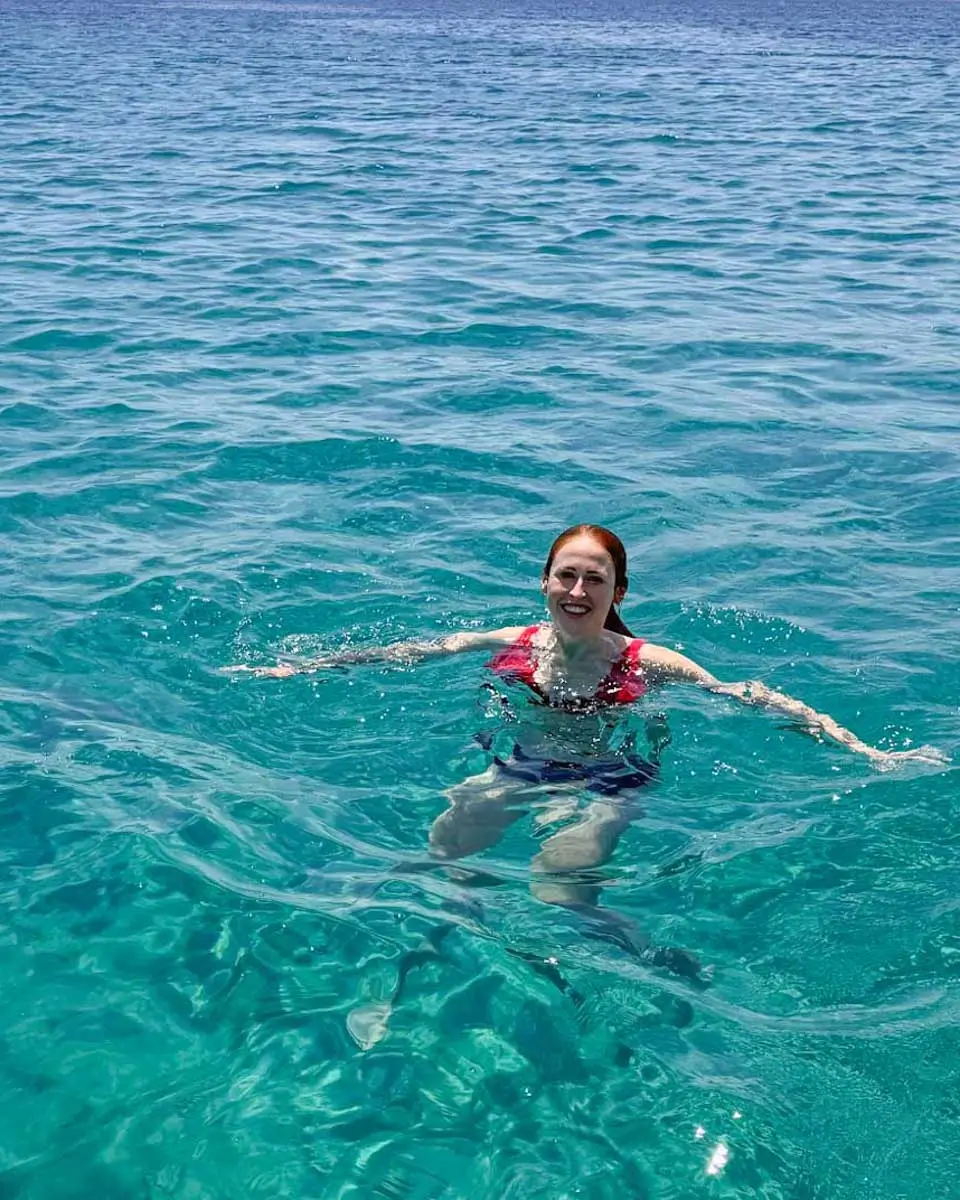 Hannah swimming during kayak tour in Santorini
