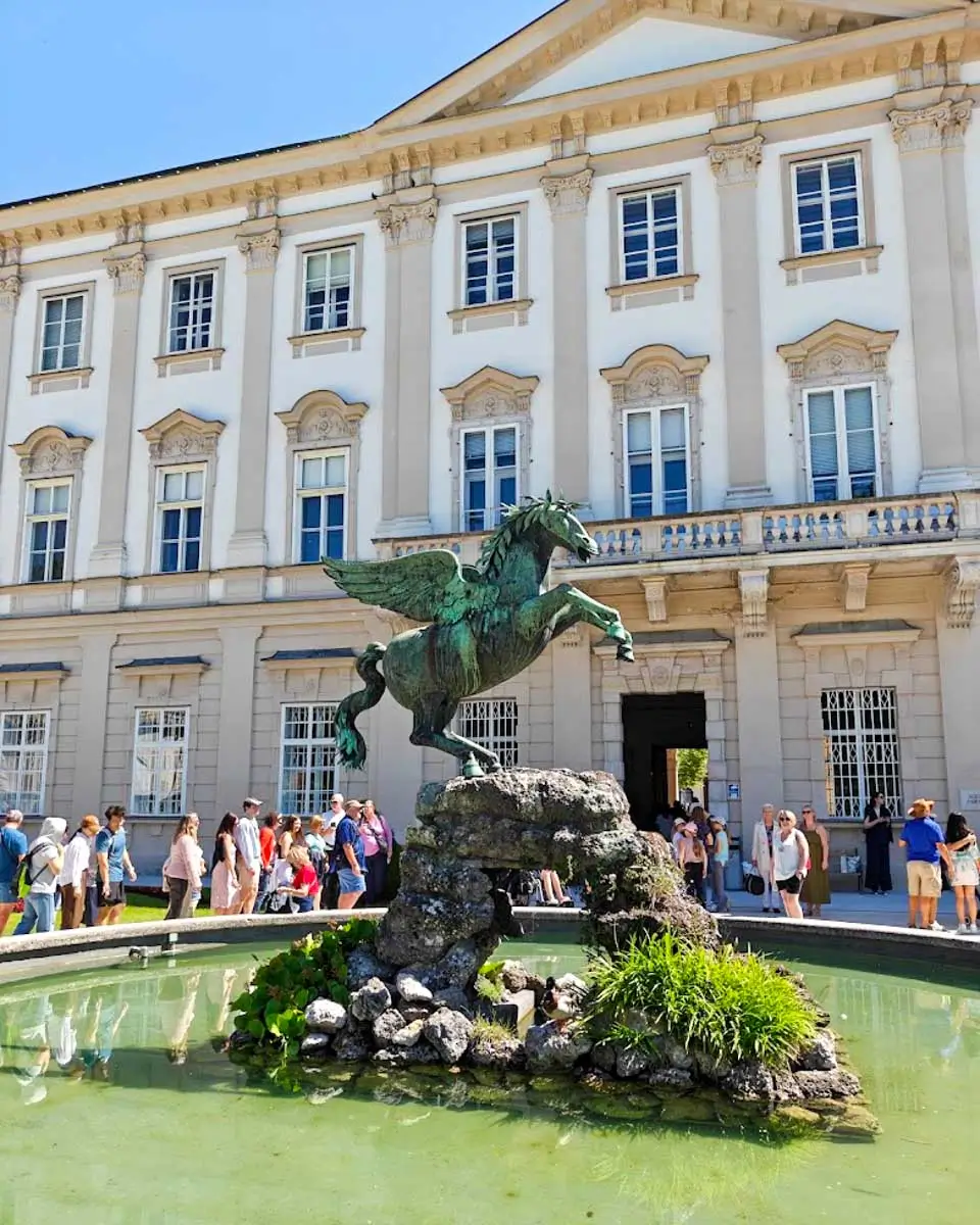 Horse statue and fountain in Mirabell Gardens in Salzburg