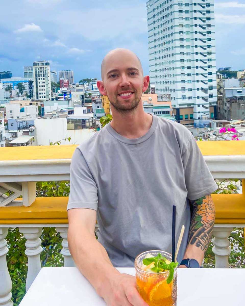 Jesse has a drink at a rooftop bar in Hanoi, Vietnam