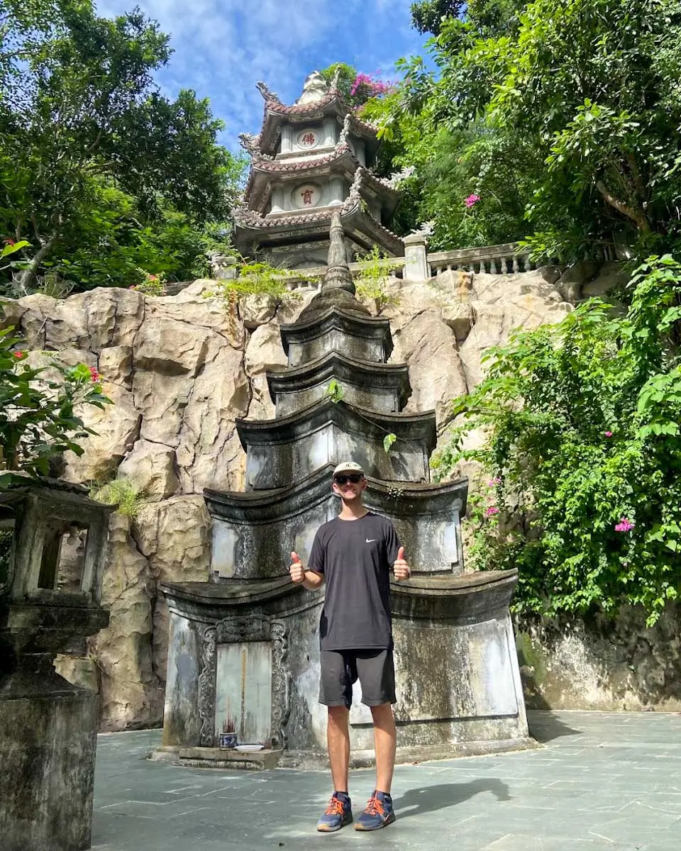 Jesse posing in front of a temple in Marble Mountains, Vietnam