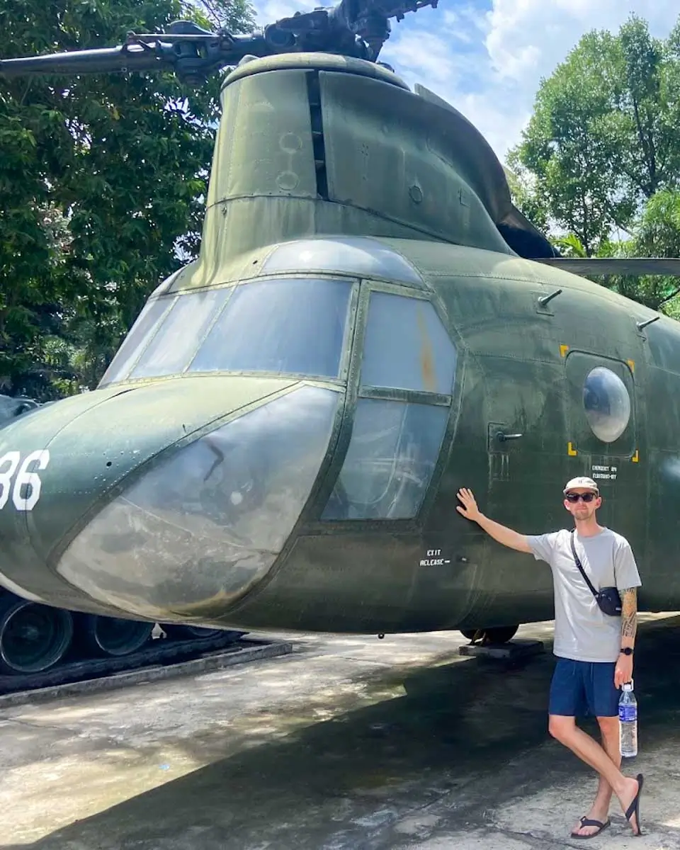 Jesse posing with the airplane at War Remnants Museum Vietnam