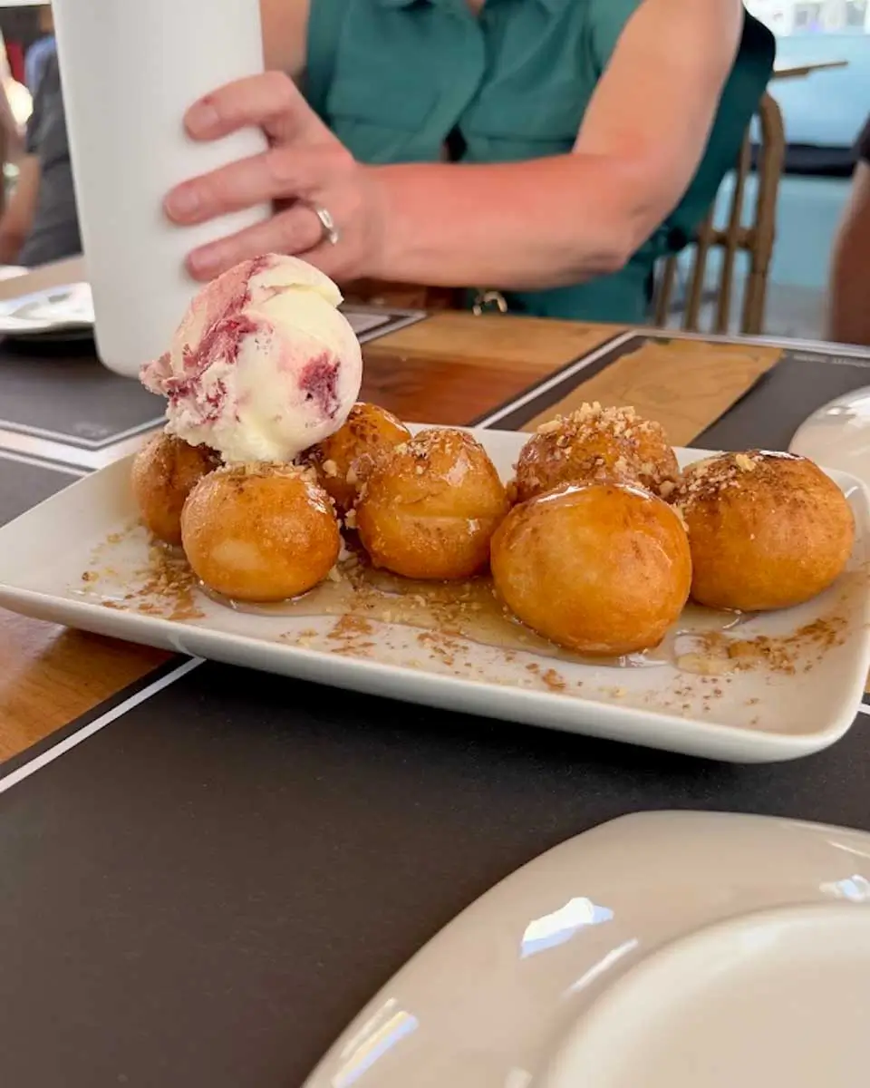 Loukoumades and ice cream on a food tour in Santorini, Greece
