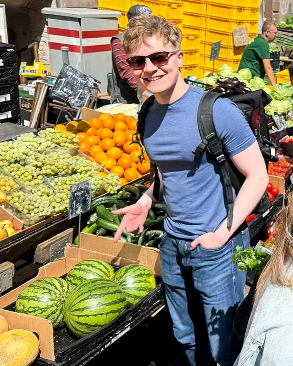 Luke exploring a local market during a Vienna food tour