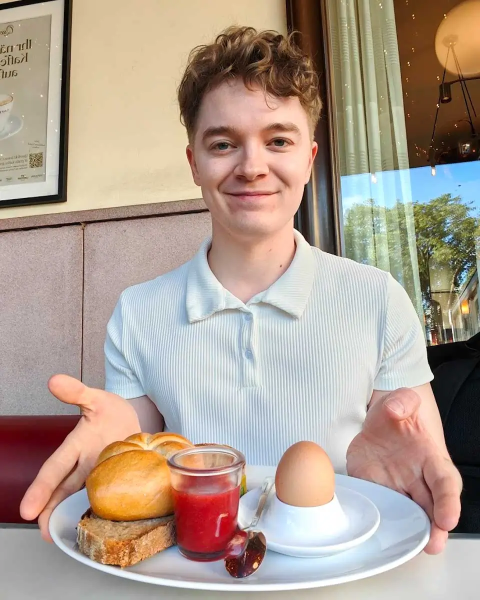 Luke having breakfast at Café Museum in Vienna