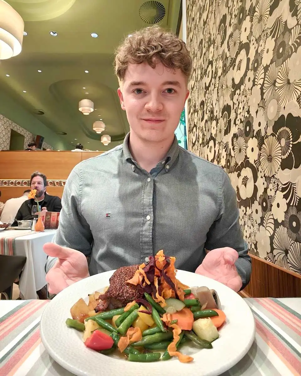 Luke enjoying a traditional Hungarian meal at Menza Restaurant in Budapest
