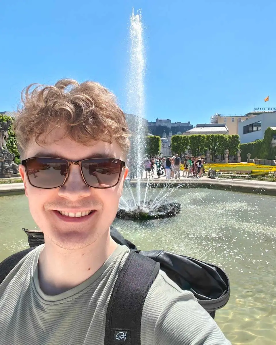 Luke taking a selfie at the Mirabell Gardens at the Original Sound of Music Tour in Salzburg