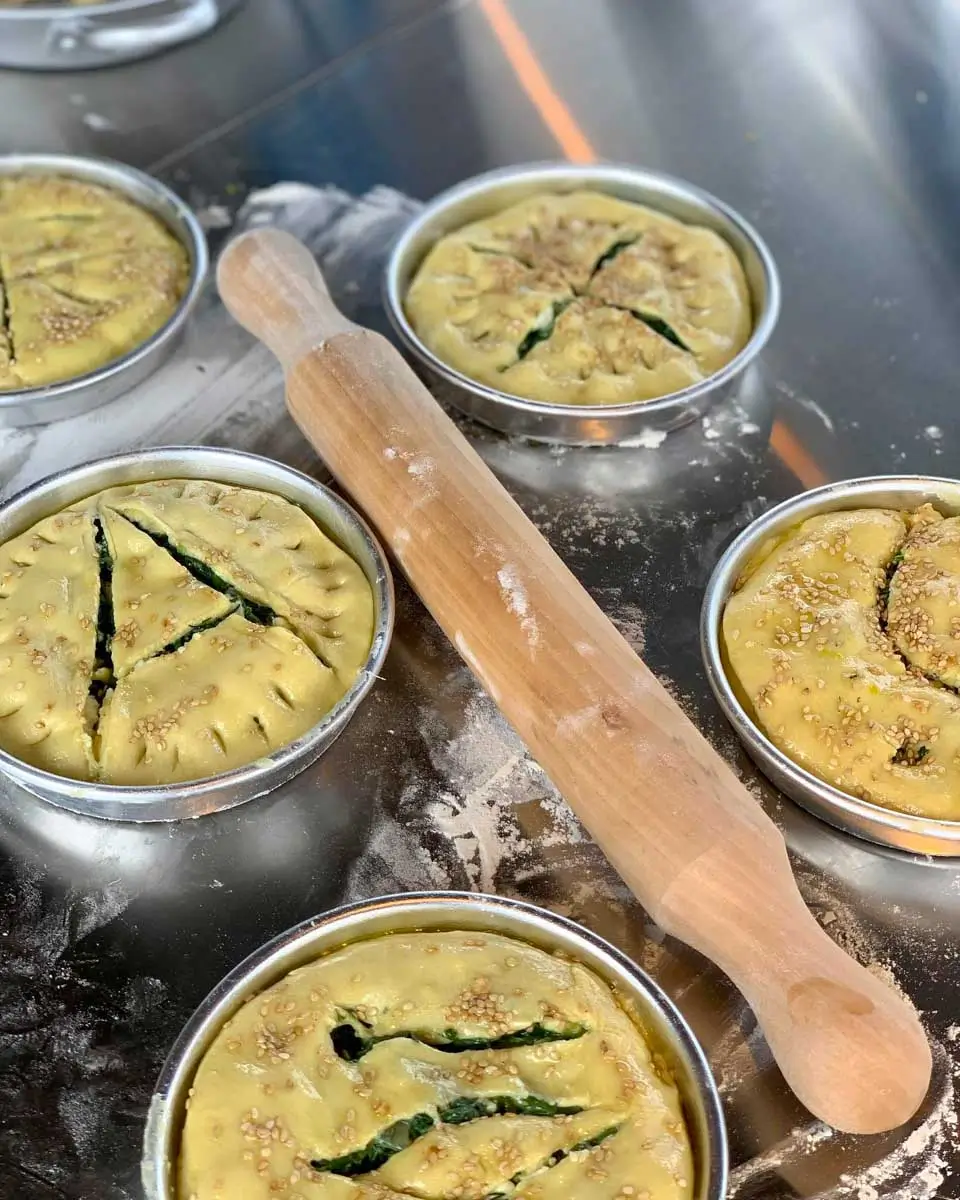 Making spinach pie during a cooking class in Athens, Greece