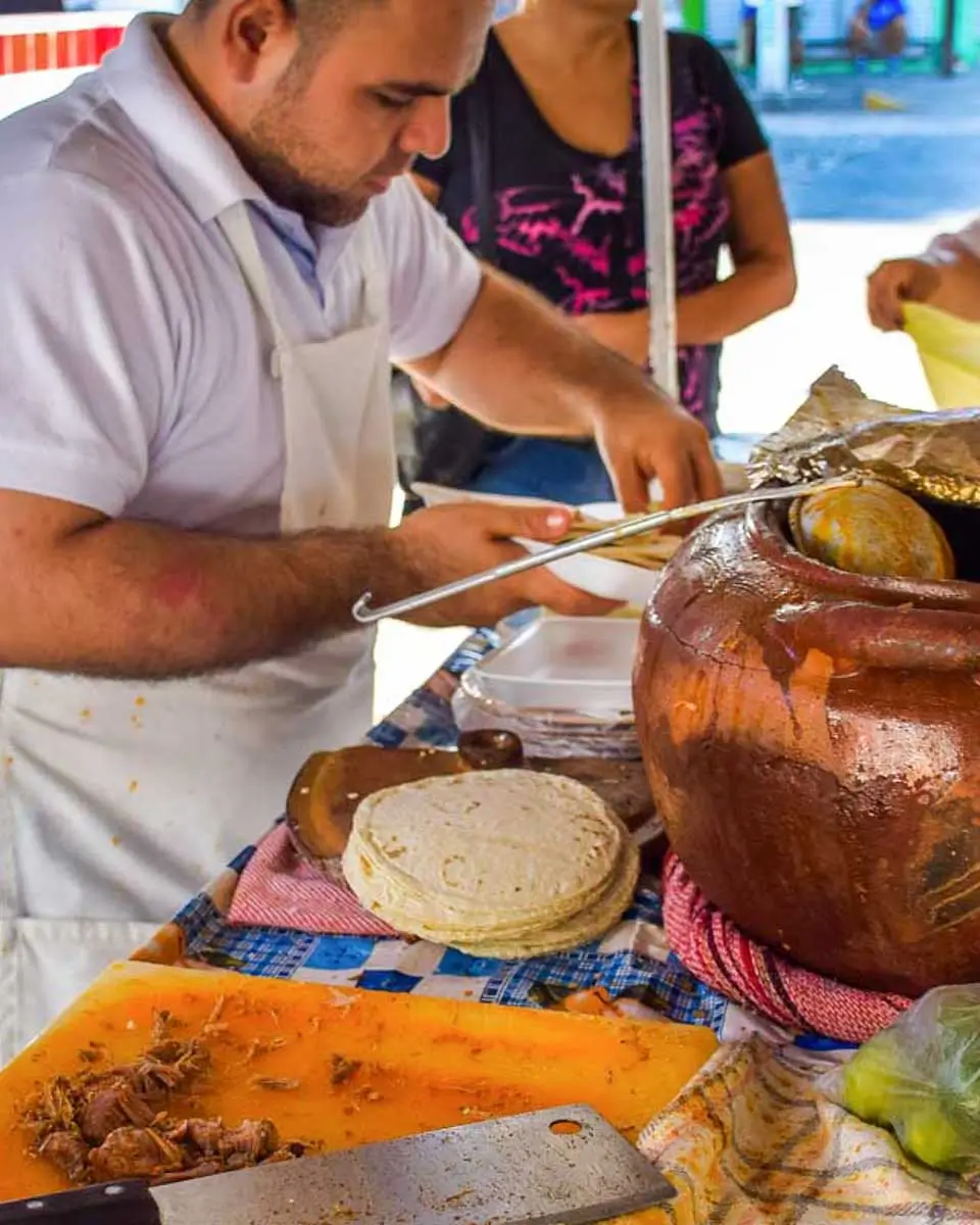 Man making tacos on a food tour in Cozumel, Mexico