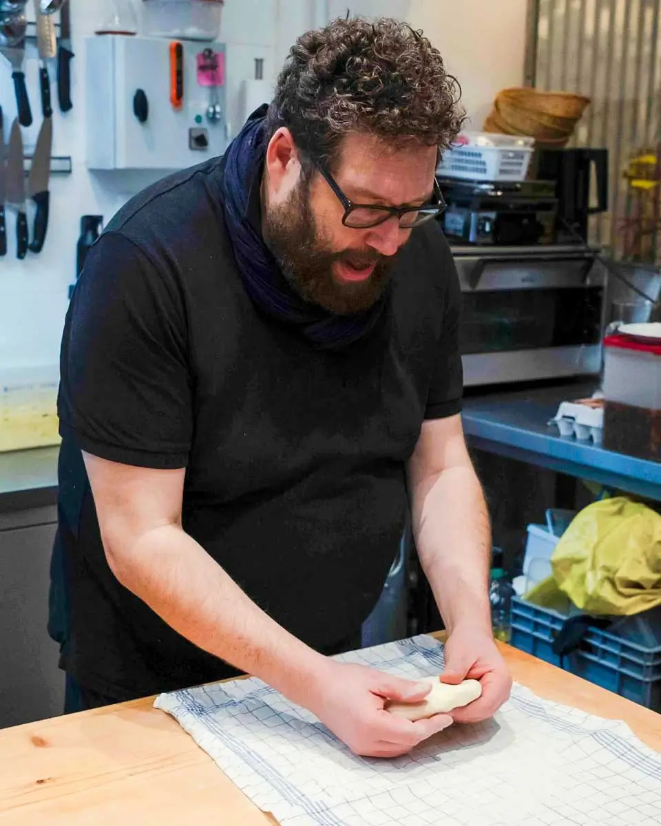 Chef Nabiel preparing traditional apple strudel in Vienna