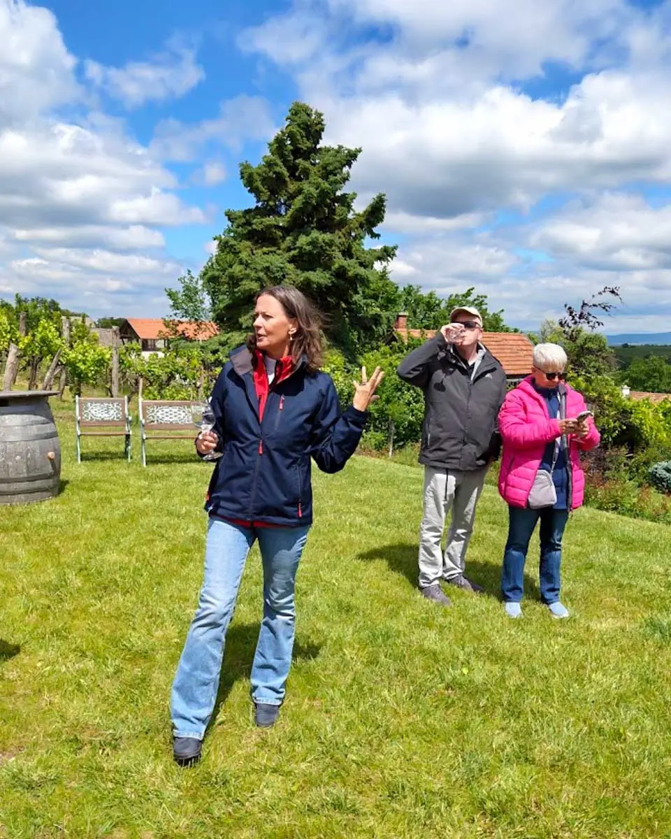 Wine tour guide Susan leading visitors through the vineyards in Etyek, Hungary