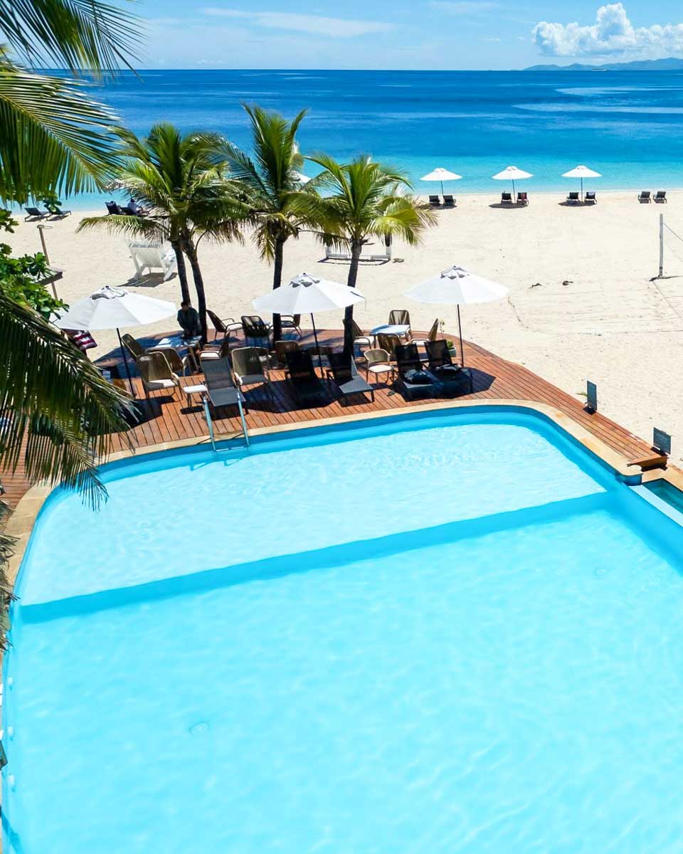 Outdoor pool and beach area at Beachcomber Island Resort in Fiji