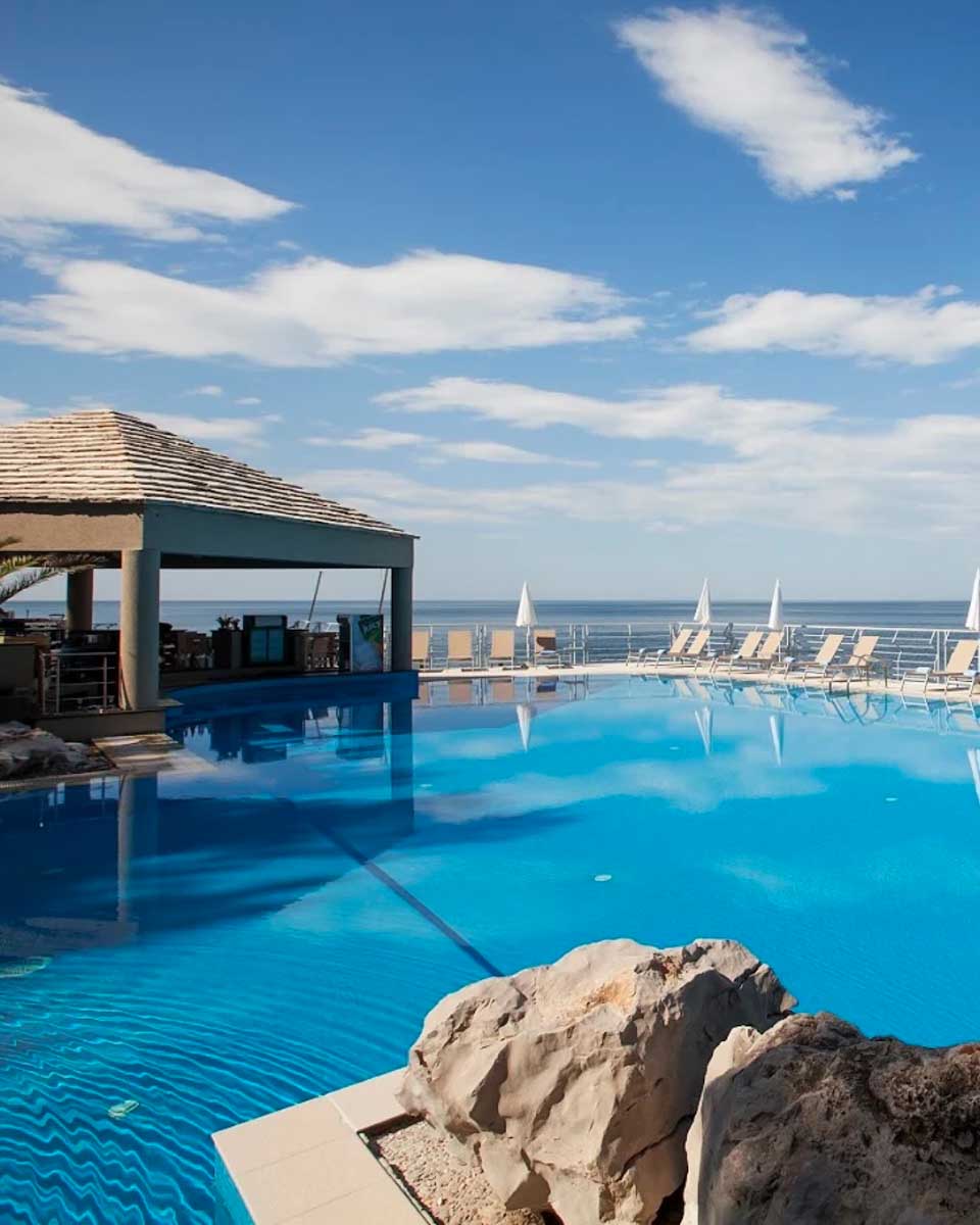 Outdoor pool area overlooking the sea at Hotel Dubrovnik Palace