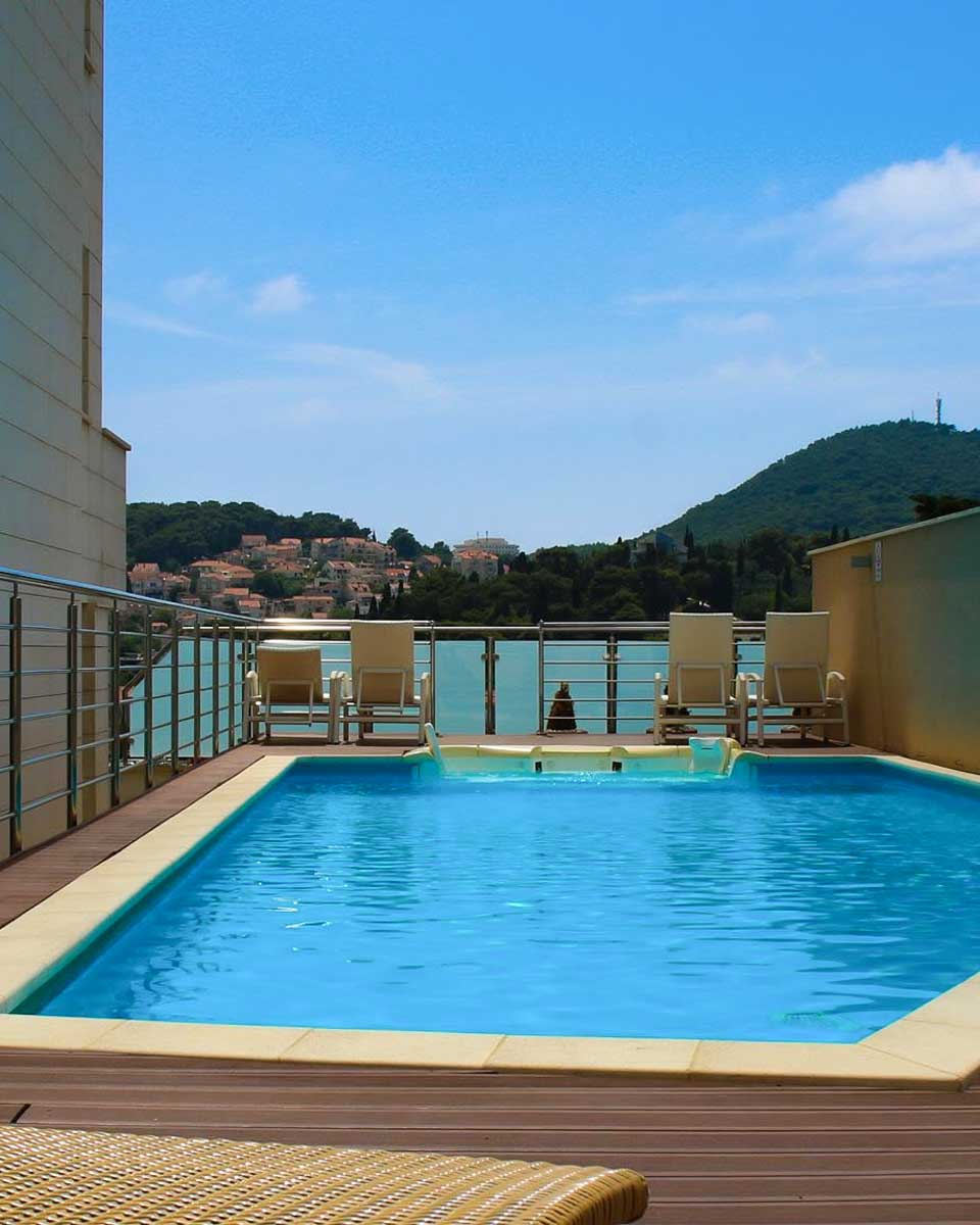 Outdoor pool area with sea view at Berkeley Hotel Dubrovnik