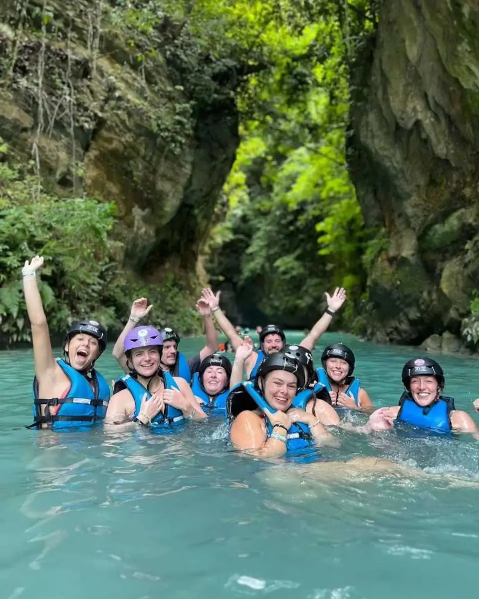 PH Kawasan Canyoneering a man jumps off of a cliff while on a tour from Cebu Philippines 1