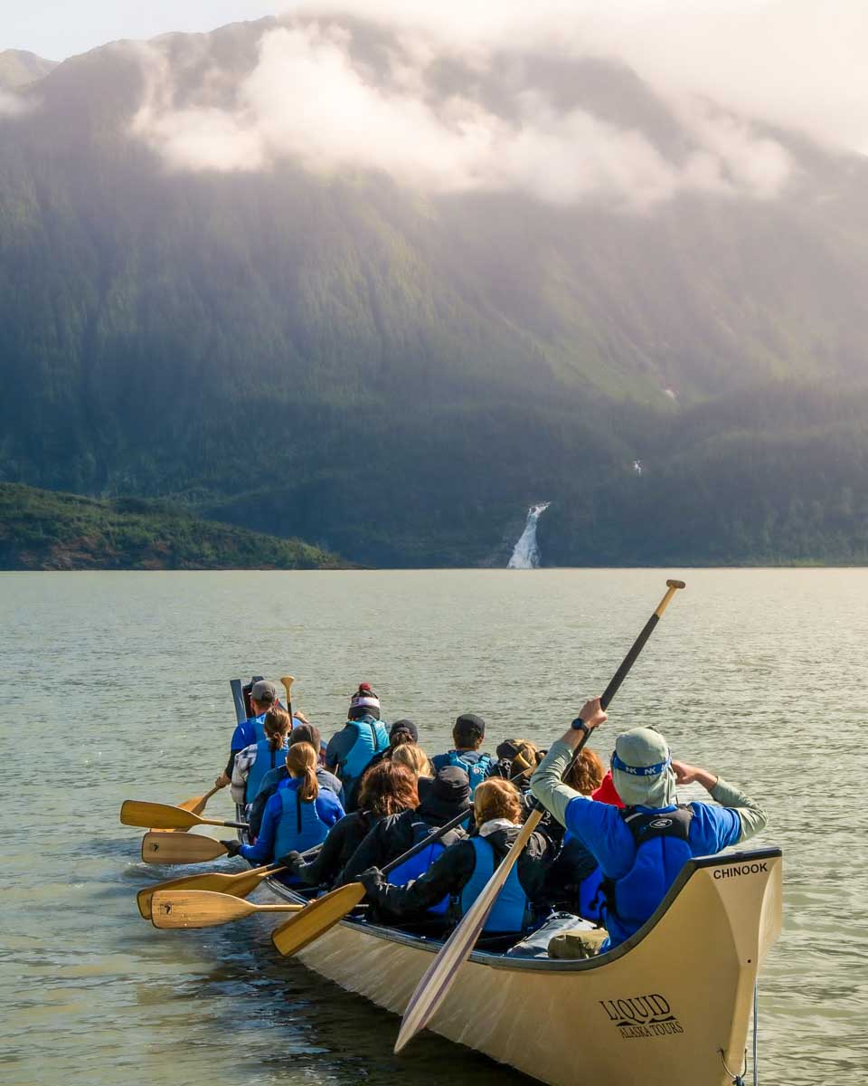 People canoe on a lake with Liquid Alaska Tours in Juneau