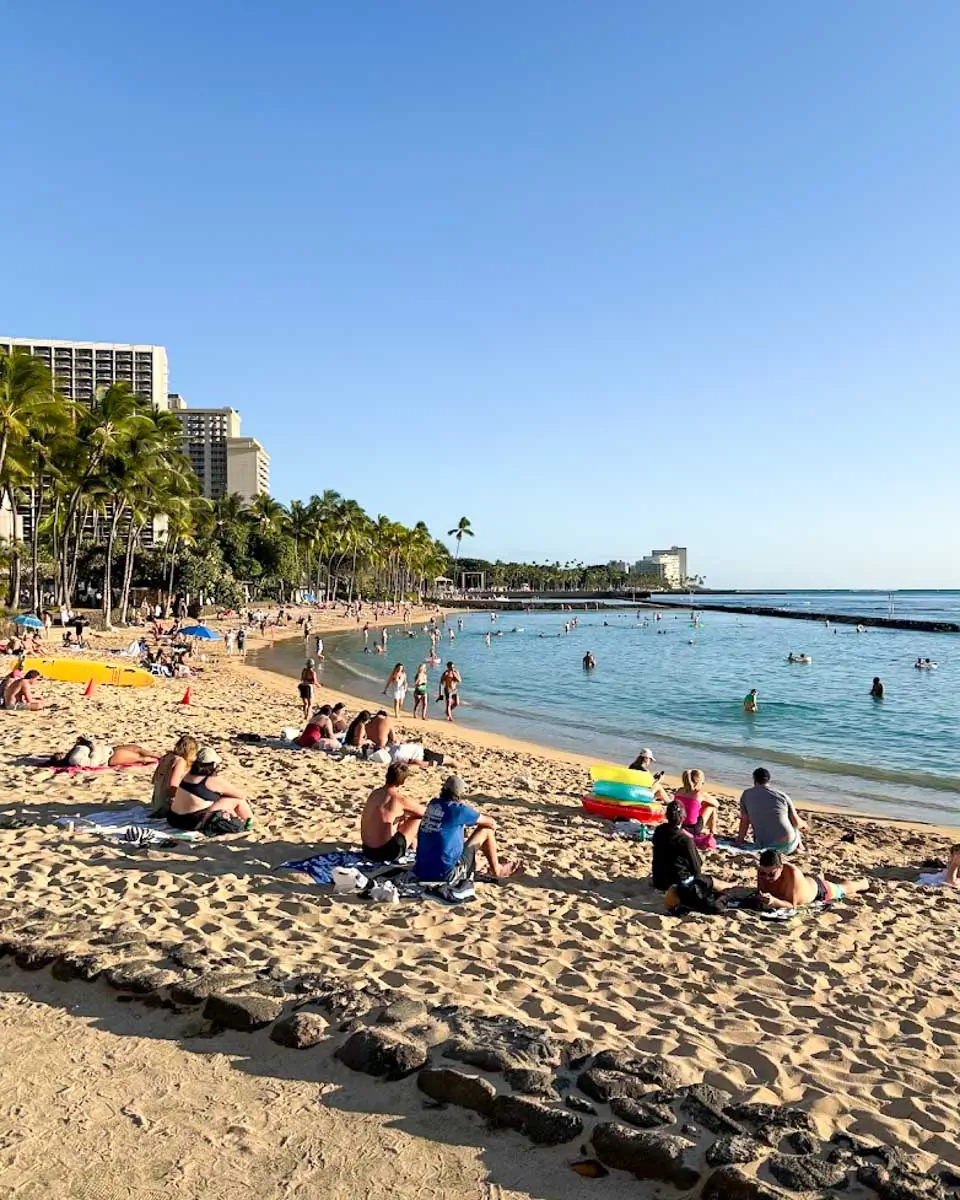 People relaxing at a beach in Honolulu, Hawaii