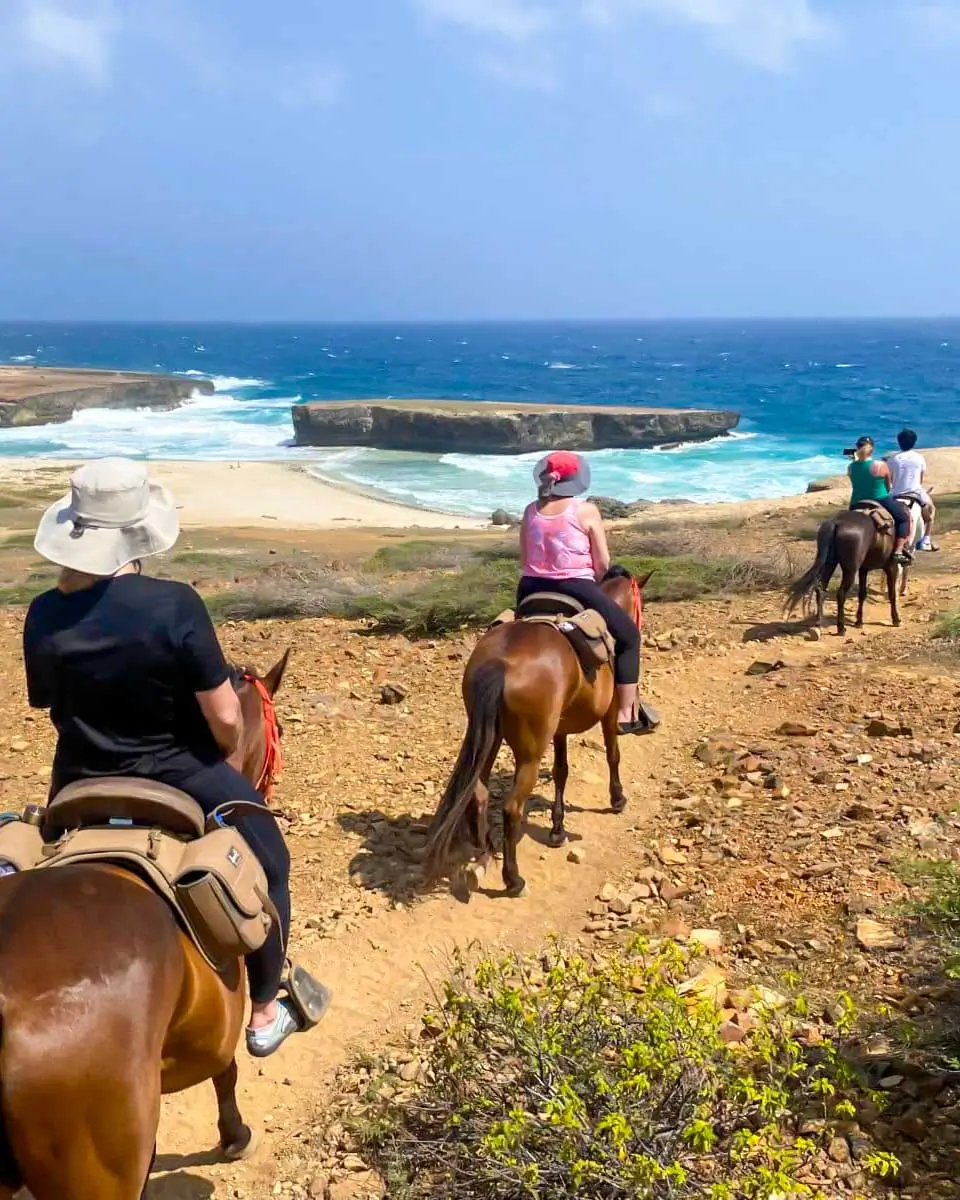 People riding horses in Arikok National Park, Aruba