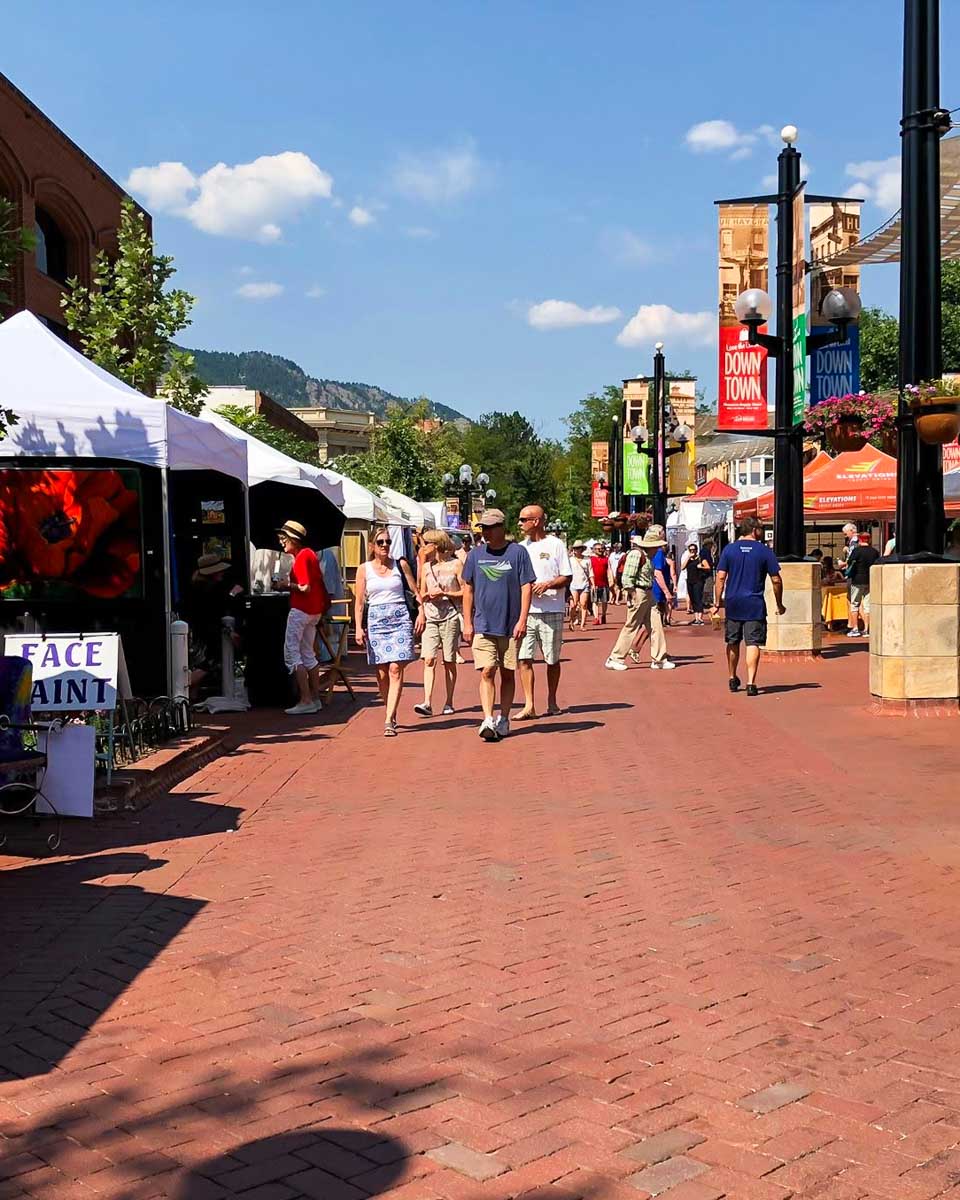 People shop at the outdoor Pearl Street Mall in Boulder Colorado