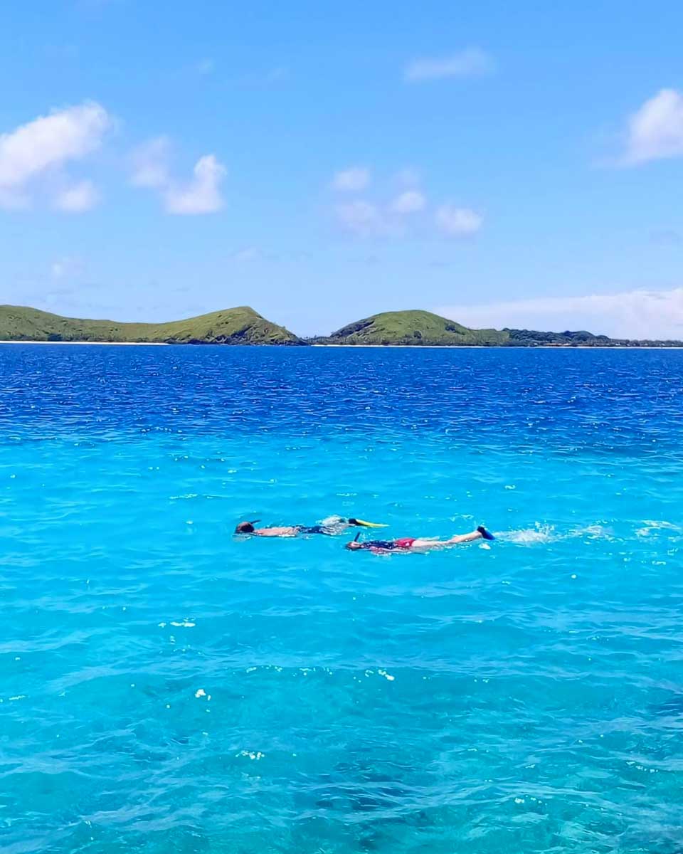 People snorkel at Tadrai Island Resort in Fiji