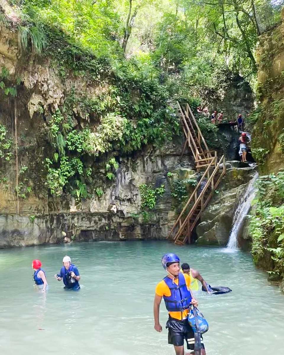 People swim at a waterfall at a tour with Edwin Transfers Tours in Puerto Plata copy